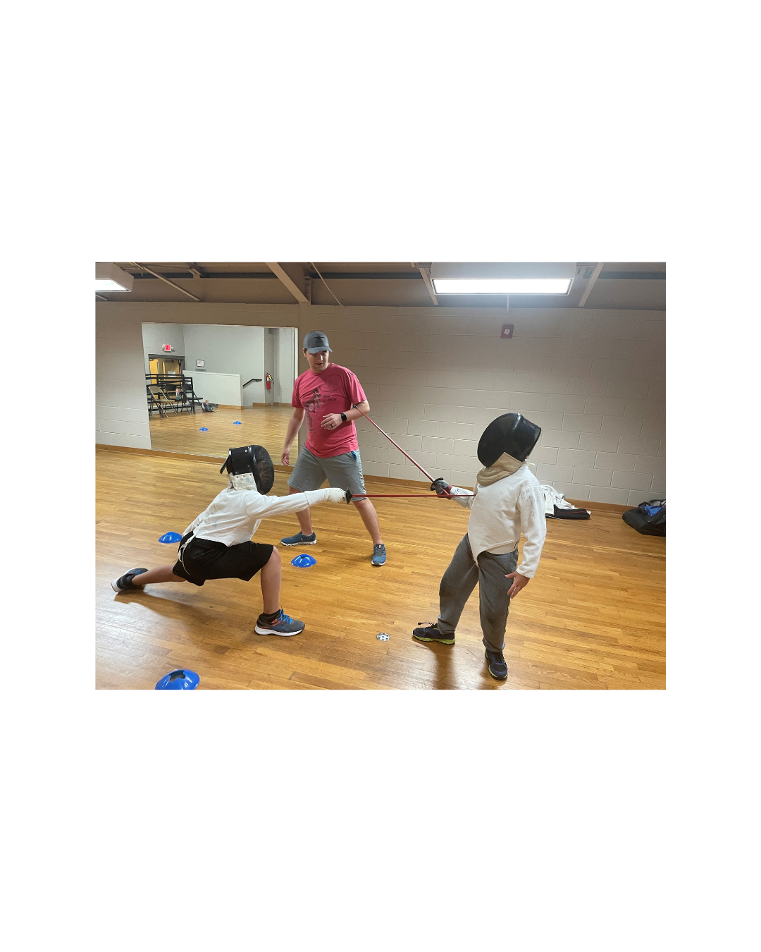 two kids practicing fencing